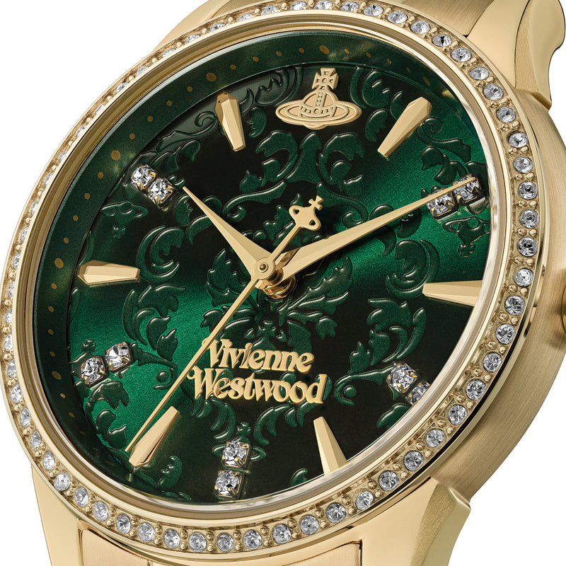 Close-up of the Vivienne Westwood Wallace watch showcasing its intricate green dial, gold plated finish, and jeweled bezel.