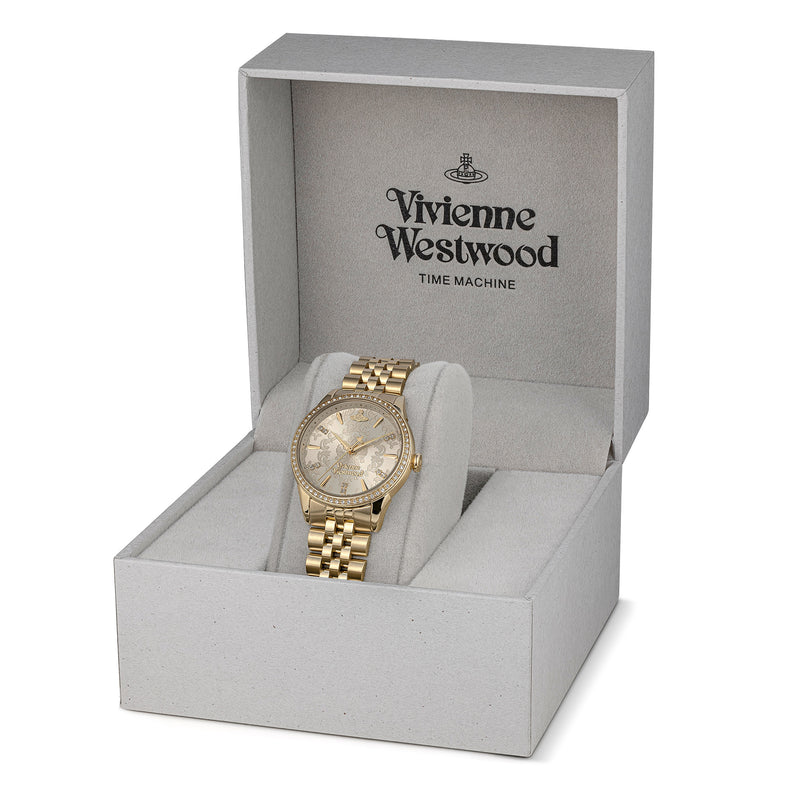 Vivienne Westwood Wallace gold watch in branded box, "TIME MACHINE" text visible. Elegant timepiece.