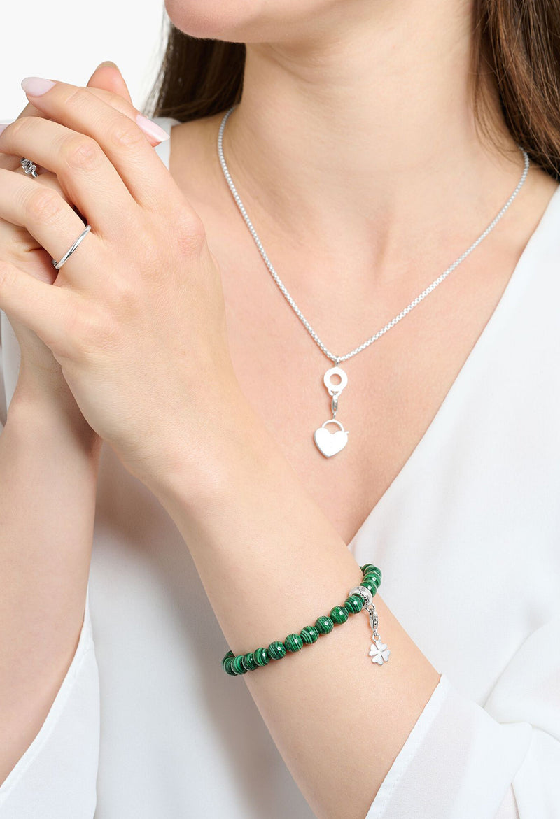 The Thomas Sabo Synthetic Malachite Charm Bracelet, a green silver-tone bracelet from Thomas Sabo, available at OD’s Jewellers in St Helens.