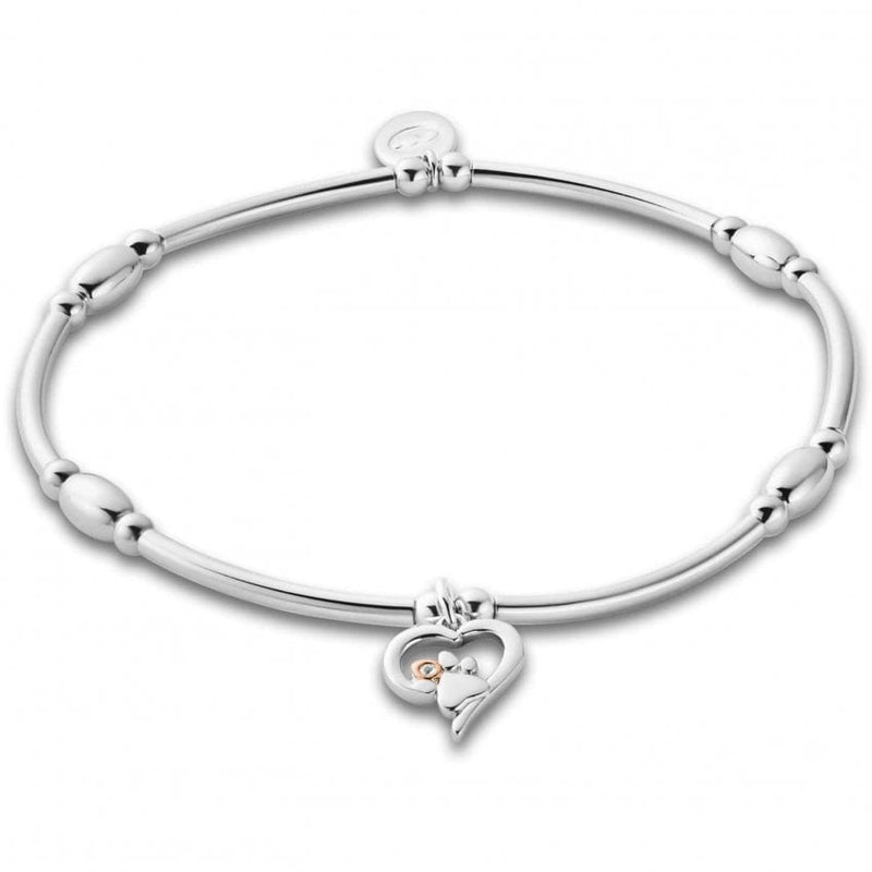 Silver charm bracelet with heart-shaped pendant. 
