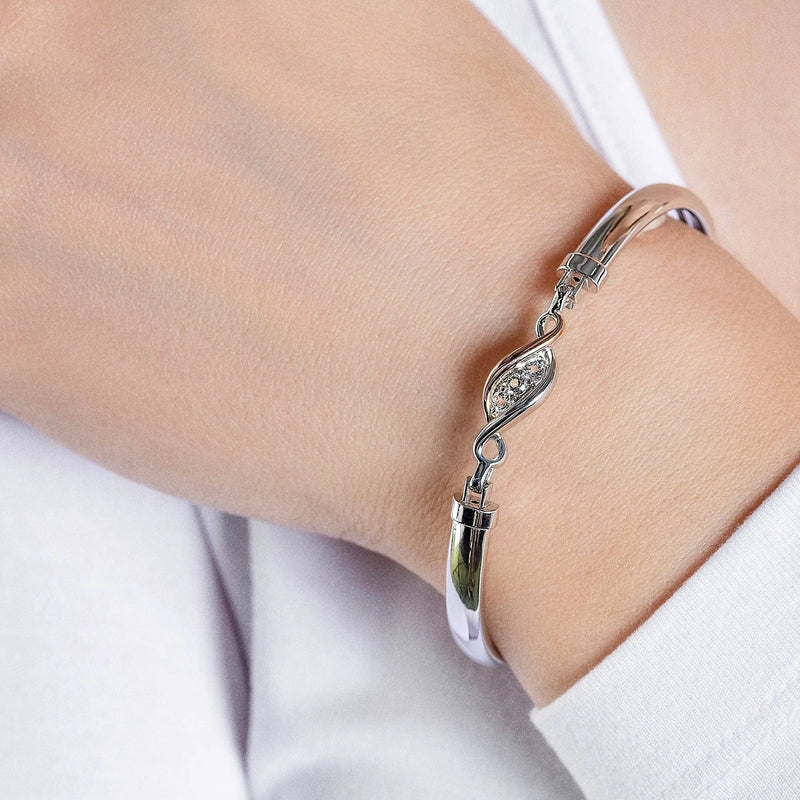 The Clogau Past Present Future Bangle With White Topaz In Sterling Silver, a silver sterling silver bracelet from Clogau, available at OD’s Jewellers in St Helens.